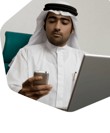 Man using mobile and computer