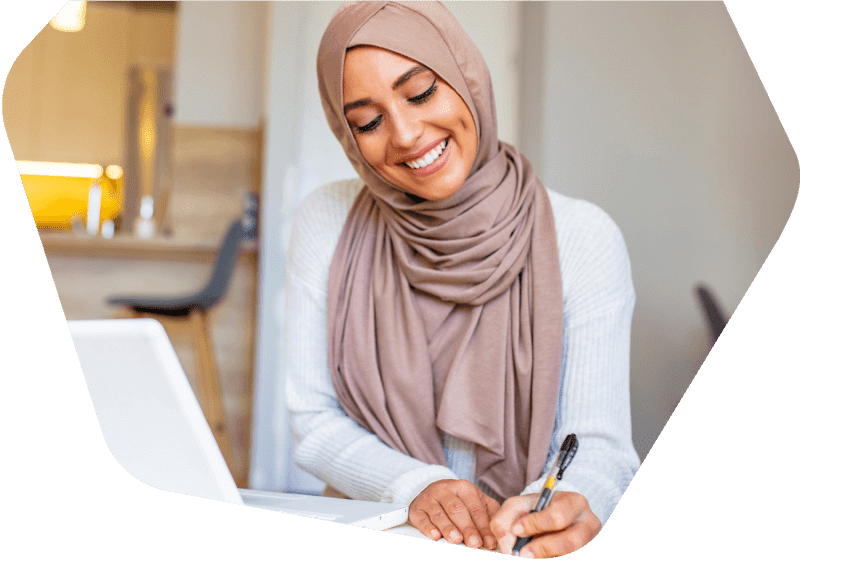 Man at home working using his phone and laptop