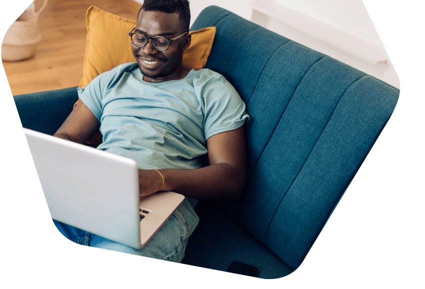 Happy family sitting together all using devices at home
